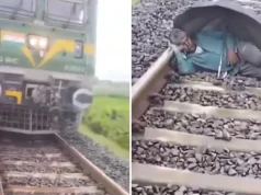 Elderly Man Sleeps on Railway Track Under Umbrella in Uttar Pradesh: Train Approaches and Miraculous Escape man-sleeps-on-tracks
